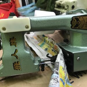Portable thread sewing bag closure machine in Kampala