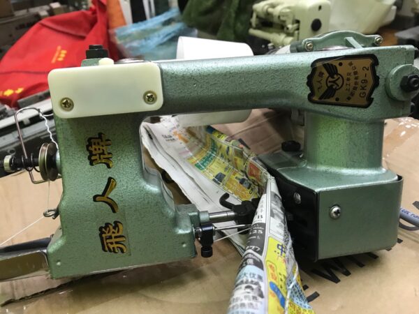 Portable thread sewing bag closure machine in Kampala